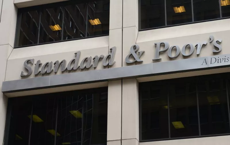 A sign for Standard &amp; Poor's rating agency stands in front of the company headquarters in New York, September 18, 2012.  AFP PHOTO/Emmanuel Dunand