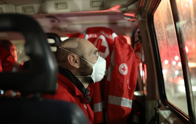 ROME, ITALY - MARCH 17: Giorgio Vacirca, a member of the Italian Red Cross, looks out of the window looking for homeless people to distribute a meal to, during the round of distribution of 50 meals in the historic city center on March 17, 2020 in Rome, Italy.
Homeless people are trapped in still cities, many assistance centers are closed due to possible contagion, some associations have stopped or slowed down their assistance activities.Nobody begs because nobody can leave the house, and without money you can't buy anything and the shops are almost all closed. Homeless people have become an emergency within the emergency. 
(Photo by Marco Di Lauro/Getty Images)