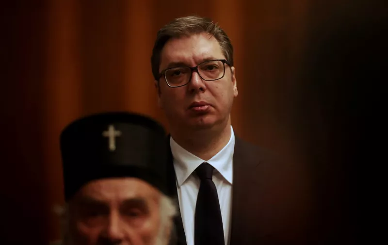 Serbian President Aleksandar Vucic (in the background) listens as Serbian Patriarch Irinej speaks, during a press conference in Belgrade on March 15, 2020.
 Serbia's president declared a state of emergency on March 15n 2020 to halt the spread of the new coronavirus, shutting down many public spaces and deploying soldiers to guard hospitals.,Image: 506680922, License: Rights-managed, Restrictions: , Model Release: no
