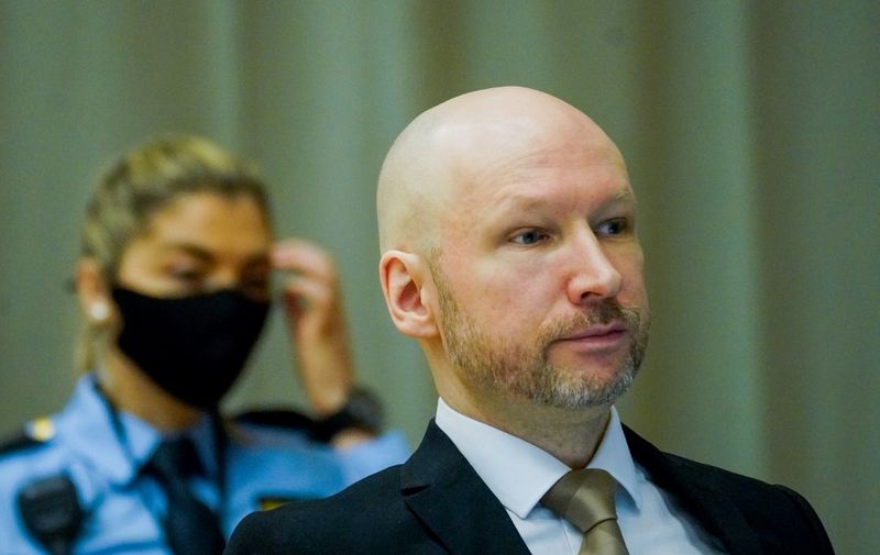 Anders Behring Breivik (R) is pictured on the first day of the trial where he is requesting release on parole, on January 18, 2022 at a makeshift courtroom in Skien prison, Norway. The mass murderer Anders Behring Breivik, who now calls himself Fjotolf Hansen, was in 2012 sentenced to a at least 21 years inprisonment. Under Norwegian law, Breivik is entitled to a review in court after the initial term of 10 years. 77 people lost their lives in the attacks that took place in Oslo and Utøya (Utoya) on July 22, 2011. (Photo by Ole Berg-Rusten / NTB / AFP) / Norway OUT