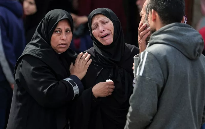 Palestinian women mourn relatives killed in an Israeli bombing in Deir el-Balah in the central Gaza Strip before the burial on March 14, 2024, amid the ongoing war between Israel and the Hamas movement. (Photo by AFP)