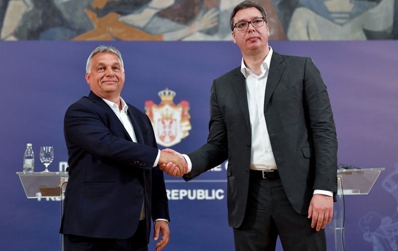 Serbian President Aleksandar Vucic (R) shakes hands with Hungarian Prime Minister Viktor Orban after a joint press conference in Belgrade on May 15, 2020. (Photo by Andrej ISAKOVIC / AFP)
