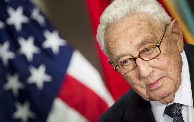 Former US Secretary of State Henry Kissinger listens as he is introduced at a ceremony honoring his diplomatic career on May 9, 2016 at the Pentagon in Washington, DC. / AFP PHOTO / Brendan Smialowski