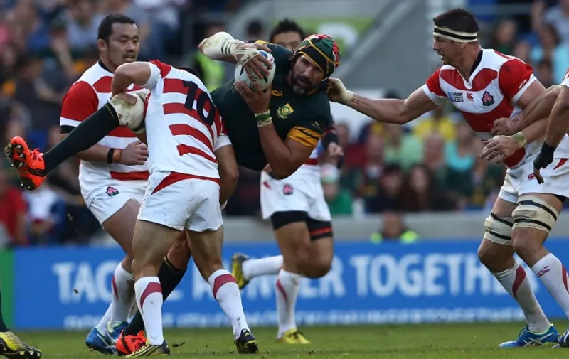 South Africa's lock Victor Matfield (3L) is tackled during a Pool B match of the 2015 Rugby World Cup between South Africa and Japan at the Brighton community stadium in Brighton, south east England on September 19, 2015. AFP PHOTO / JUSTIN TALLIS

RESTRICTED TO EDITORIAL USE, NO USE IN LIVE MATCH TRACKING SERVICES, TO BE USED AS NON-SEQUENTIAL STILLS