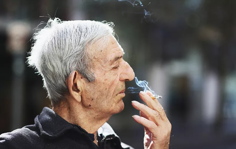 SYDNEY, AUSTRALIA - MAY 04:  A man smokes a cigarette on May 04, 2016 in Sydney, New South Wales.The Australian Government yesterday announced in their budget four annual 12.5 per cent increases to tobacco excise and excise equivalent customs duties which will significantly push up the over-the counter price up to AUD$40 by 2020.  (Photo by Ryan Pierse/Getty Images)