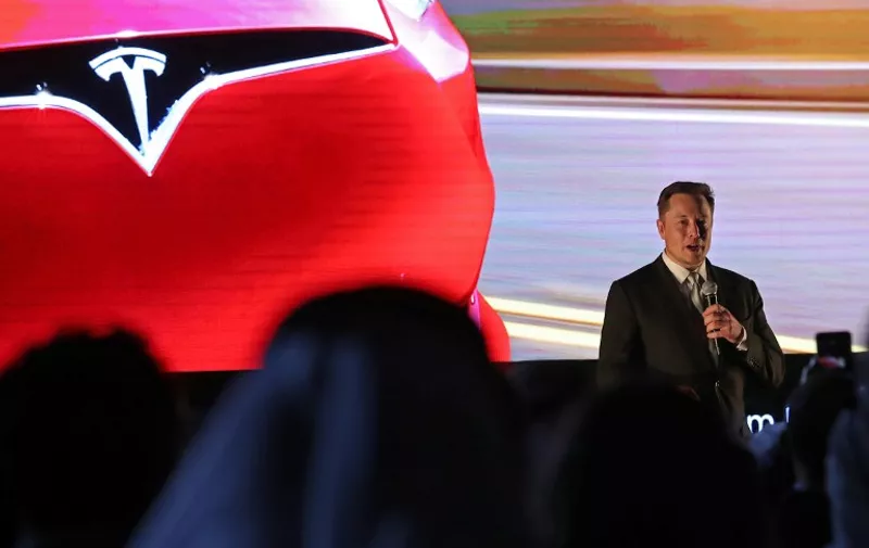 Elon Musk, the co-founder and chief executive of Electric carmaker Tesla, speaks during a ceremony in Dubai on February 13, 2017.
Tesla announced the opening of a new Gulf headquarters in Dubai, aiming to conquer an oil-rich region better known for gas guzzlers than environmentally friendly motoring. / AFP PHOTO / KARIM SAHIB