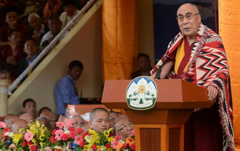 The Dalai Lama (R) speaks at an event to celebrate his 80th birthday at Tsuglakhang temple in McLeod Ganj on June 22, 2015. The Dalai Lama marked his official 80th birthday on June 21, with prayers and celebrations at his hometown in exile but little to show for decades of lobbying for greater Tibetan autonomy. AFP PHOTO / NARINDER NANU
