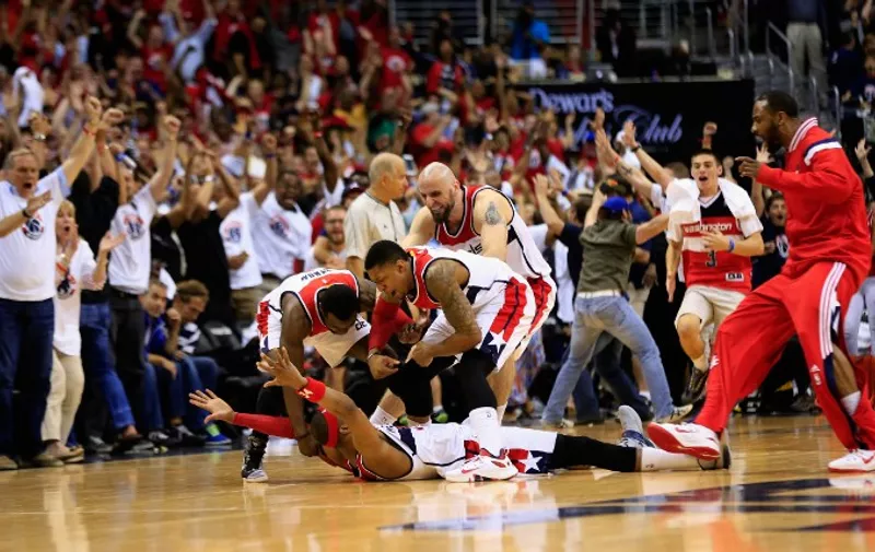 WASHINGTON, DC - MAY 09: Paul Pierce #34 of the Washington Wizards lays on the ground and celebrates with teammates after hitting the game winning shot to give the Wizards a 103-101 win over the Atlanta Hawks in Game Three of the Eastern Conference Semifinals of the 2015 NBA Playoffs at Verizon Center on May 9, 2015 in Washington, DC. NOTE TO USER: User expressly acknowledges and agrees that, by downloading and or using this photograph, User is consenting to the terms and conditions of the Getty Images License Agreement.   Rob Carr/Getty Images/AFP