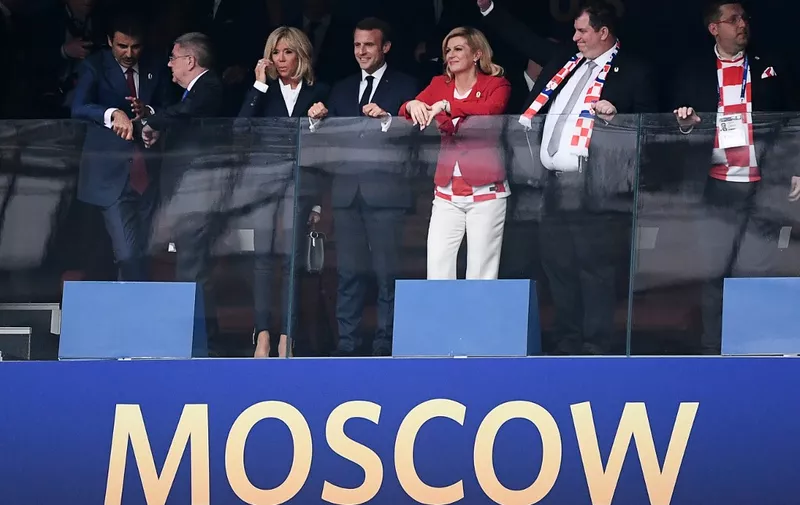 (L to R) Amir of Qatar Sheikh Tamim bin Hamad al-Thani, International Olympic Committee (IOC) President Thomas Bach, French First lady Brigitte Macron, French President Emmanuel Macron, Croatian President Kolinda Grabar-Kitarovic and her husband Jakov Grabar-Kitarovic attend the Russia 2018 World Cup final football match between France and Croatia at the Luzhniki Stadium in Moscow on July 15, 2018. (Photo by Jewel SAMAD / AFP) / RESTRICTED TO EDITORIAL USE - NO MOBILE PUSH ALERTS/DOWNLOADS