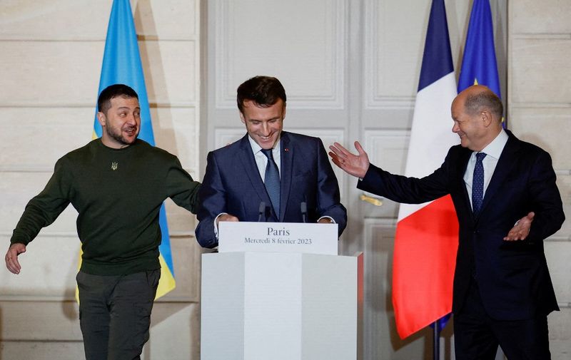 France's President Emmanuel Macron (C), Ukraine's President Volodymyr Zelensky (L) and Germany's Chancellor Olaf Scholz react during a joint statement at the presidential Elysee Palace in Paris, on February 8, 2023. (Photo by SARAH MEYSSONNIER / POOL / AFP)
