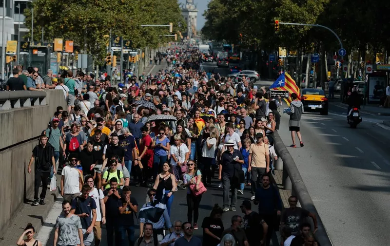 People protest in Barcelona on October 14, 2019, after Spain's Supreme Court sentenced nine Catalan leaders to prison terms ranging from nine to 13 years for sedition and misuse of public funds for their role in a failed 2017 independence bid. (Photo by Pau Barrena / AFP)