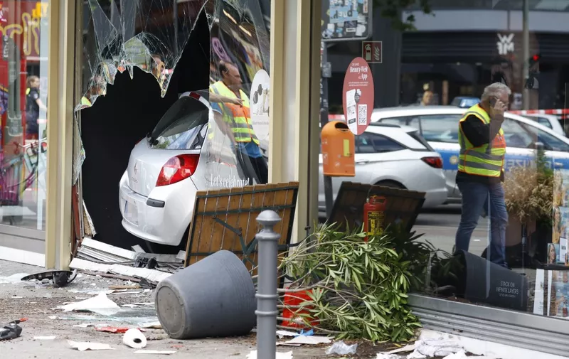 The car that was driven into a group of people killing one person and injuring eight injured is pictured in central Berlin, on June 8, 2022. - A police spokeswoman said the driver was detained at the scene after the car ploughed into a shop front in a busy shopping street in Charlottenburg district. It was not clear whether the crash was intentional. (Photo by Odd ANDERSEN / AFP)