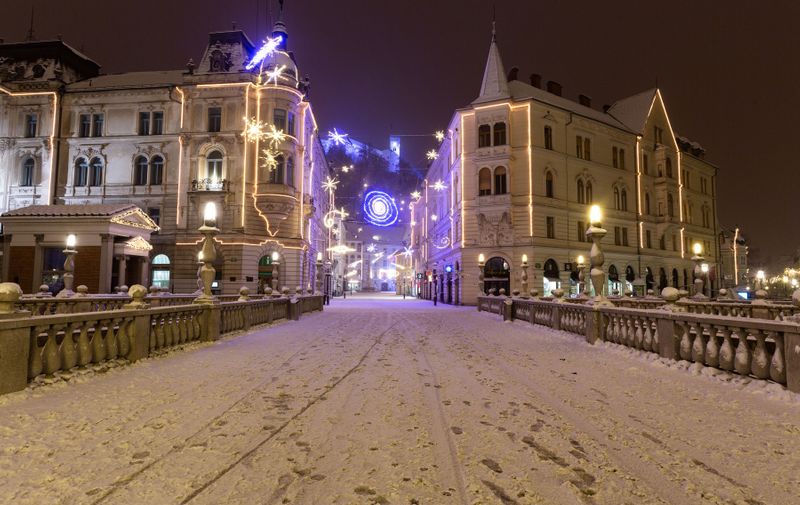 View of an empty City Center illuminated by Christmas lights during curfew.
The curfew in Slovenia has been in effect for over a month. The streets of Ljubljana decorated with Christmas lights during this year's festive December are empty after 21:00.
Curfew during festive season in Ljubljana, Slovenia - 02 Dec 2020,Image: 573249306, License: Rights-managed, Restrictions: , Model Release: no