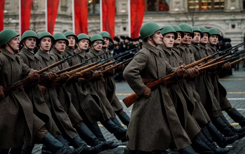 Russian servicemen dressed in historical uniforms march during the military parade at Red Square in Moscow on November 7, 2019, as part of the ceremonies marking the 78th anniversary of the 1941 historical parade, when Red Army soldiers marched past the Kremlin walls towards the front line to fight Nazi Germany troops during World War II. (Photo by Dimitar DILKOFF / AFP)