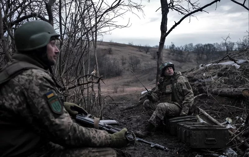 Soldiers of the Ukrainian Volunteer Army hold their positions at the front line near Bakhmut, Donetsk region, on March 11, 2023, amid the Russian invasion of Ukraine. (Photo by Sergey SHESTAK / AFP)