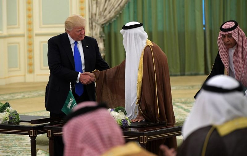 US President Donald Trump (L) and Saudi Arabia's King Salman bin Abdulaziz al-Saud shake hands during a signing ceremony at the Saudi Royal Court in Riyadh on May 20, 2017. / AFP PHOTO / MANDEL NGAN