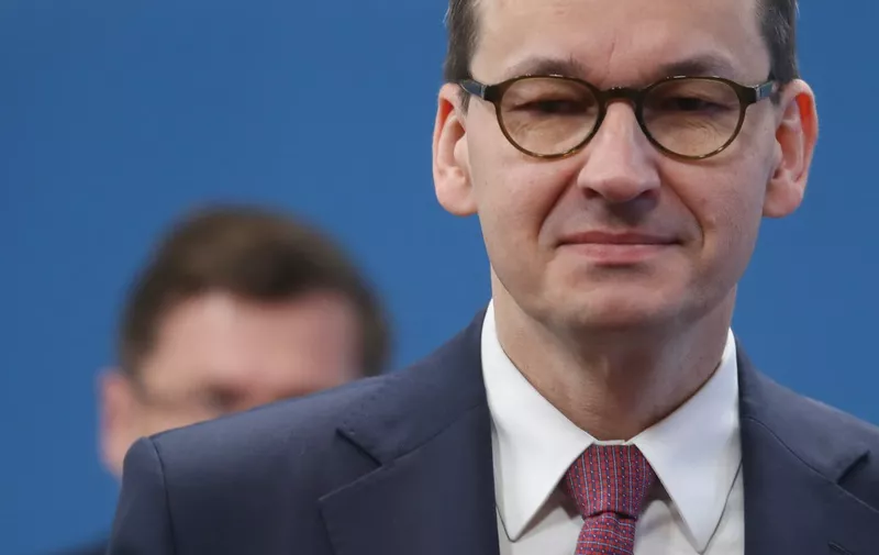 Poland's Prime Minister Mateusz Morawiecki arrives for the second day of a special European Council summit in Brussels on February 21, 2020, held to discuss the next long-term budget of the European Union (EU). (Photo by Ludovic Marin / POOL / AFP)