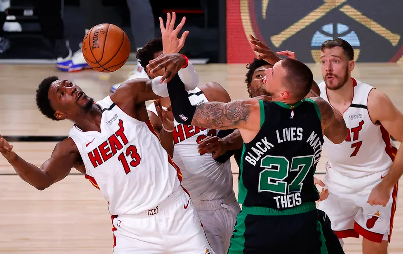 LAKE BUENA VISTA, FLORIDA - SEPTEMBER 17: Bam Adebayo #13 of the Miami Heat fights for possession during the third quarter against Daniel Theis #27 of the Boston Celtics in Game Two of the Eastern Conference Finals during the 2020 NBA Playoffs at AdventHealth Arena at the ESPN Wide World Of Sports Complex on September 17, 2020 in Lake Buena Vista, Florida. NOTE TO USER: User expressly acknowledges and agrees that, by downloading and or using this photograph, User is consenting to the terms and conditions of the Getty Images License Agreement.  (Photo by Kevin C. Cox/Getty Images)