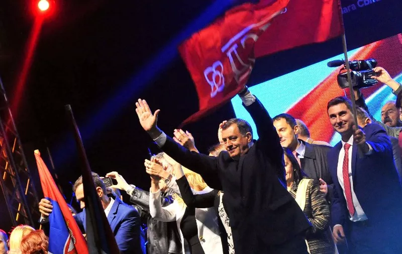 President of Bosnia and Herzegovina's entity Republika Srpska, Milorad Dodik acknowledges supporters during his address at a rally in Bosnian Serb stronghold town of Pale near Sarajevo, late on September 25, 2016, declaring that referendum held during the day was successful.  
Serbs in Bosnia voted on whether to keep celebrating a statehood day in January, a date tied to the fragile nation's brutal 1990s war and a sensitive issue for other ethnic groups. The poll was the brainchild of Milorad Dodik, nationalist leader of the Bosnian Serb-run entity Republika Srpska (RS), which partners the Muslim-Croat Federation in the divided country.
 / AFP PHOTO / ELVIS BARUKCIC