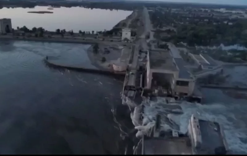 KHERSON, UKRAINE - JUNE 6: (----EDITORIAL USE ONLY - MANDATORY CREDIT - " ZELENSKYY SOCIAL MEDIA ACCOUNT / HANDOUT" - NO MARKETING NO ADVERTISING CAMPAIGNS - DISTRIBUTED AS A SERVICE TO CLIENTS----) A screen grab captured from a video shows the Kakhovka Hydroelectric Power Plant after a blast occurred in plant which is in the Russian-controlled part of Ukraine's Kherson on June 6, 2023. The explosion unleashed floodwaters across the war zone. Zelenskyy Social Media Account / Handout / Anadolu Agency (Photo by Zelenskyy Social Media Account / / ANADOLU AGENCY / Anadolu Agency via AFP)