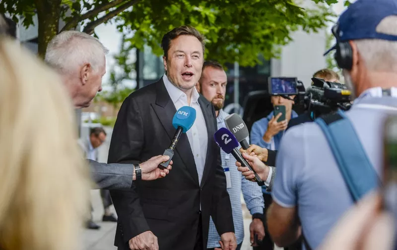 Tesla CEO Elon Musk gives interviews as he arrives at the Offshore Northern Seas 2022 (ONS) meeting in Stavanger, Norway on August 29, 2022. - The meeting, held in Stavanger from August 29 to September 1, 2022, presents the latest developments in Norway and internationally related to the energy, oil and gas sector. (Photo by Carina Johansen / NTB / AFP) / Norway OUT