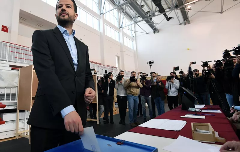 Montenegro's presidential candidate Jakov Milatovic casts his ballot at the polling station to vote in the second round of the presidential election in Podgorica, on April 2, 2023. - Montenegrins cast ballots on Sunday, for a final presidential contest, pitting the Adriatic nation's longest serving leader, Milo Djukanovic against Jakov Milatovic, a relative newcomer on country's political scene. (Photo by SAVO PRELEVIC / AFP)