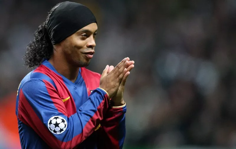 Barcelona's Brazilian midfielder Ronaldinho rubs his hands before the game against Celtic in the UEFA Cup Champions League at Celtic Park, Glasgow, Scotland, on February 20, 2008. AFP PHOTO/ANDREW YATES / AFP / ANDREW YATES