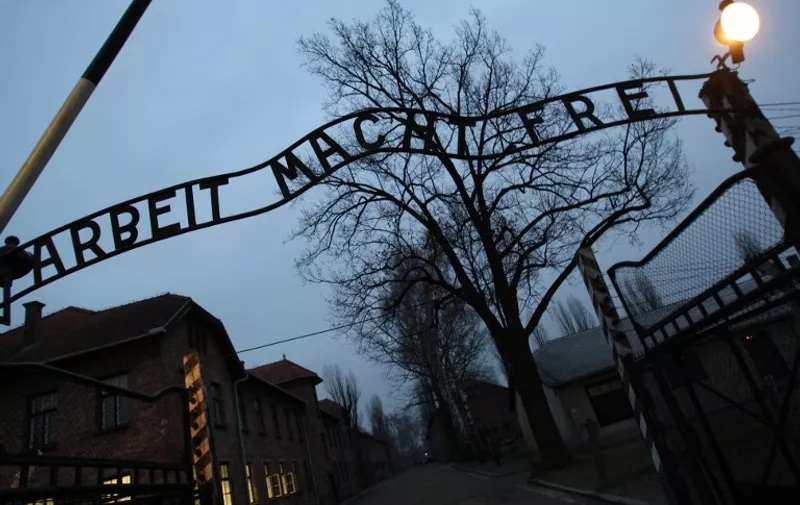 This photo taken on December 04, 2008 shows the entrance to Auschwitz, former Nazi death camp, in Oswiecim, with the inscription "Arbeit macht frei". AFP PHOTO VALERY HACHE