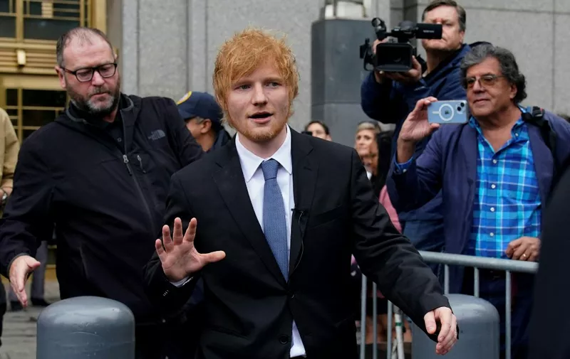 British singer-songwriter Ed Sheeran (C) departs Manhattan Federal Court in New York, on May 4, 2023. - British pop phenom Ed Sheeran did not plagiarize Marvin Gaye's "Let's Get It On" when composing his 2014 hit "Thinking Out Loud," a US jury ruled Thursday. (Photo by TIMOTHY A. CLARY / AFP)