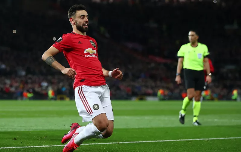 MANCHESTER, ENGLAND - FEBRUARY 27: Bruno Fernandes of Manchester United celebrates after scoring his team's first goal from the penalty spot during the UEFA Europa League round of 32 second leg match between Manchester United and Club Brugge at Old Trafford on February 27, 2020 in Manchester, United Kingdom. (Photo by Clive Brunskill/Getty Images)