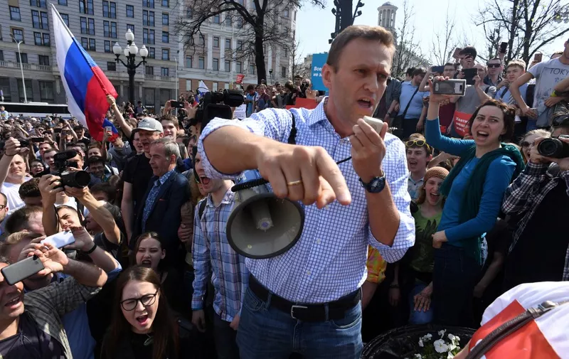(FILES) Russian opposition leader Alexei Navalny addresses supporters during an unauthorized anti-Putin rally on May 5, 2018 in Moscow, two days ahead of Vladimir Putin's inauguration for a fourth Kremlin term. Navalny's posthumous memoir will be released in October, chronicling his 2020 poisoning and life in a brutal Russian prison camp, the US publisher of the book said on April 11, 2024. The key opponent of Russian leader Vladimir Putin died in February in a penal colony, where he had been held in harsh conditions.  Titled "Patriot," the book will be released on October 22, publisher Knopf said in a statement. (Photo by Kirill KUDRYAVTSEV / AFP)