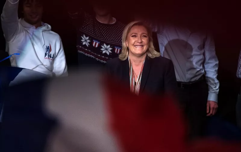 Marine Le Pen (C), leader of the French far-right Front National (FN) party, smiles during her campaign rally for the upcoming regional elections in the Nord pas de Calais-Picardie, on November 30, 2015 in Lille, northern France, ahead of the December 6 and December 13 French regional elections. AFP PHOTO / PHILIPPE HUGUEN / AFP PHOTO / PHILIPPE HUGUEN