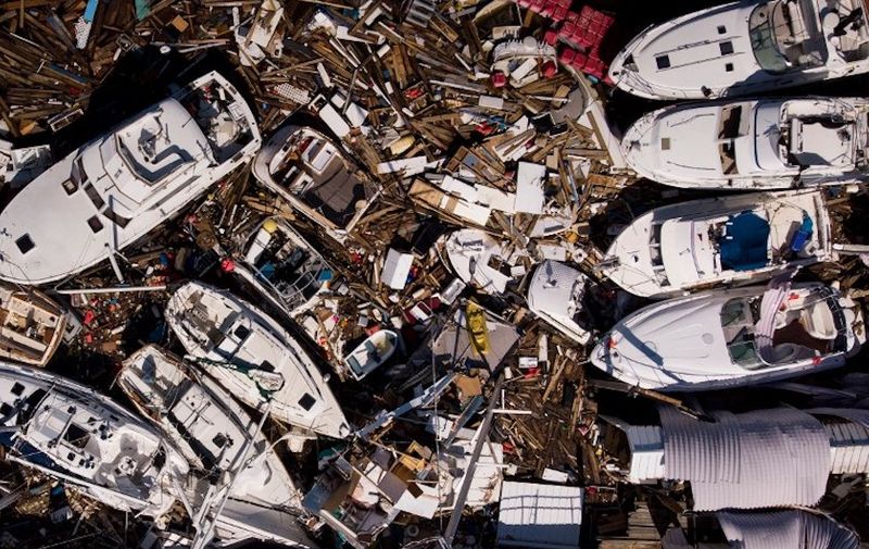 In this aerial view, storm damaged boats are seen in the aftermath of Hurricane Michael on October 11, 2018 in Panama City, Florida. - Residents of the Florida Panhandle woke to scenes of devastation Thursday after Michael tore a path through the coastal region as a powerful hurricane that killed at least two people. (Photo by Brendan Smialowski / AFP)