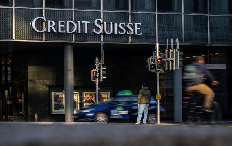 A picture taken on October 25, 2022 shows a sign of Switzerland's second-biggest bank Credit Suisse on a branch in Basel. - New Credit Suisse chief executive, faced with trying to turn around the beleaguered bank following multiple scandals, is set to unveil his strategic road map on October 27, 2022 as the pressure is on for Switzerland's second-biggest bank after investors saw their money go up in smoke due to the collapse in share prices. (Photo by Fabrice COFFRINI / AFP)