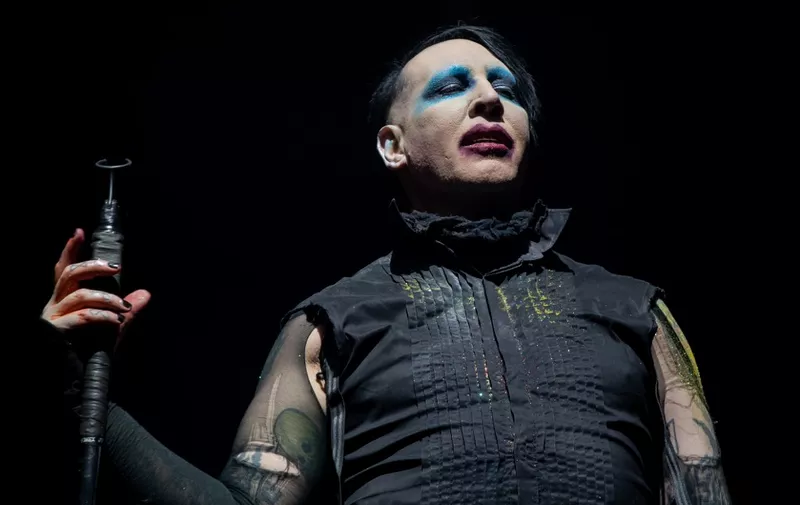 (FILES) In this file photo Marilyn Manson performs during the Astroworld Festival at NRG Stadium on November 9, 2019 in Houston, Texas - "Westworld" star Evan Rachel Wood on February 1, 2021 accused industrial rock icon Marilyn Manson of being a "dangerous man" who subjected her to years of abuse starting when she was a teenager.  The American actress, who began working in entertainment as a child, has in the past alleged abuse by an ex-partner whom she kept anonymous, but on Monday identified her abuser as "Brian Warner, also known to the world as Marilyn Manson." (Photo by SUZANNE CORDEIRO / AFP)