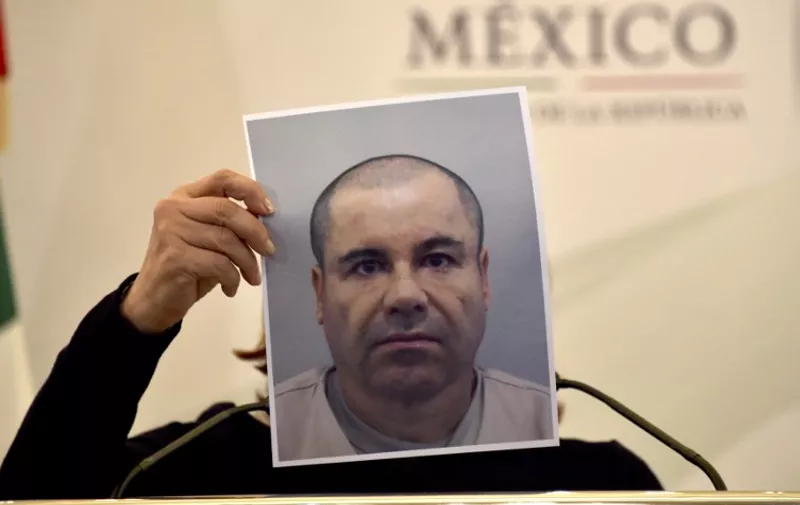 Mexico's Attorney General Arely Gomez shows a picture of Mexican drug kingpin Joaquin "El Chapo" Guzman during a press conference held at the Secretaria de Gobernacion in Mexico City, on July 13, 2015. Guzman managed to escape from his cell despite a monitoring bracelet and 24-hour security camera surveillance, and likely was helped by prison officials, authorities said Monday.  AFP PHOTO/YURI CORTEZ