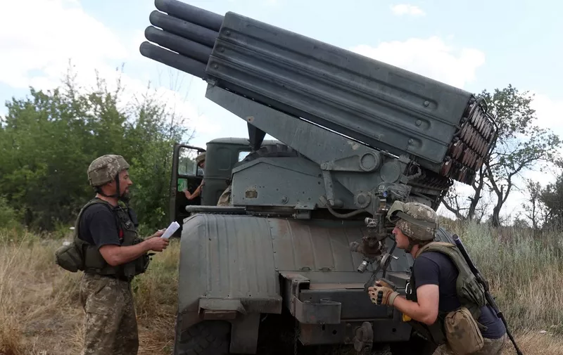 Ukrainian servicemen prepare to fire a Grad BM-21 multiple rocket launcher at the front line between Russian and Ukraine forces in the countryside of the eastern Ukrainian region of Donbas on July 19, 2022 amid the Russian invasion of Ukraine. (Photo by Anatolii Stepanov / AFP)