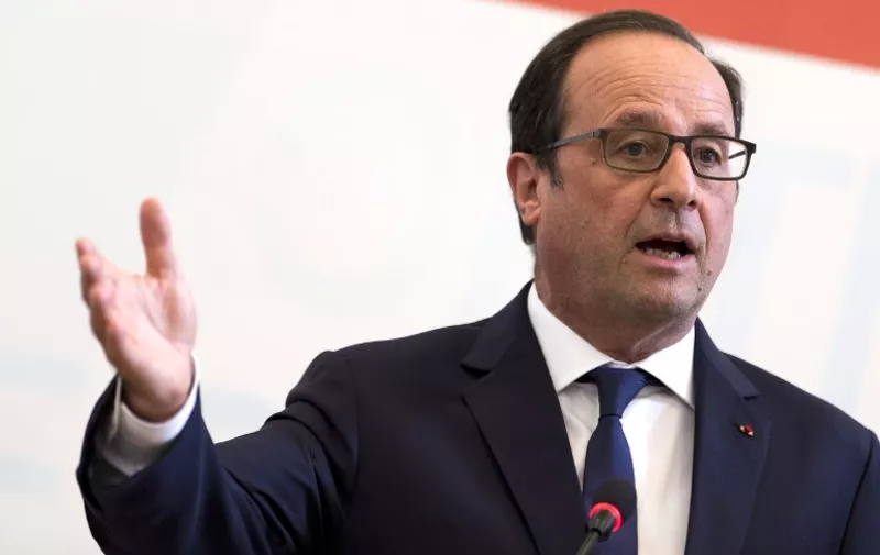 French President Francois Hollande gives a press conference during a meeting of the Visegrad Four (V4) group on June 19, 2015 at Bratislava castle. Hollande insisted that "everything" must be done to seal a compromise on the Greek debt crisis before an emergency eurozone summit in Brussels Monday (June 22, 2015). AFP PHOTO / KENZO TRIBOUILLARD