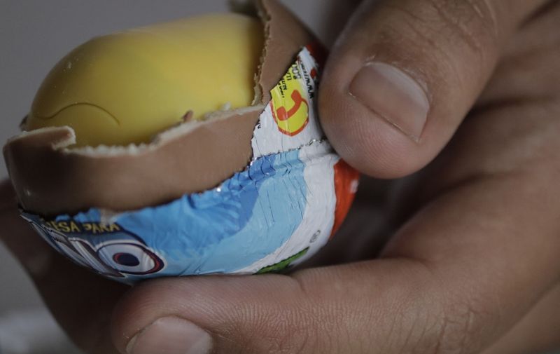 A young man uncovers a Kinder Surprise egg in Mexico City.

The Federal Commission for the Protection against Health Risks (Cofepris) issued an alert on Monday about the possible salmonella contamination of four batches of Kinder mini eggs and Kinder Surprise Maxi, which are being voluntarily recalled worldwide by the manufacturer. (Photo by Gerardo Vieyra/NurPhoto) (Photo by Gerardo Vieyra / NurPhoto / NurPhoto via AFP)