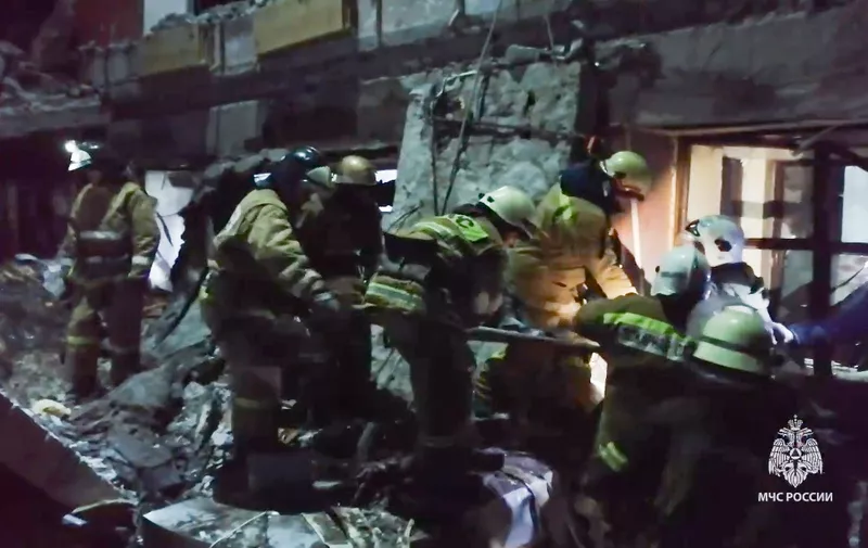 RUSSIA, LUGANSK PEOPLE'S REPUBLIC - FEBRUARY 3, 2024: Search-and-rescue efforts take place at the scene of a Ukrainian military strike on a bakery in Lisichansk, 70km northwest of Lugansk, two lives lost, six taken to hospital, up to 40 civilians allegedly trapped under the rubble. Video screen grab. Best quality available. Emercom/TASS,Image: 843334641, License: Rights-managed, Restrictions: THIS STILL IMAGE WAS PROVIDED 3 February 2024 BY A THIRD PARTY. EDITORIAL USE ONLY, Model Release: no