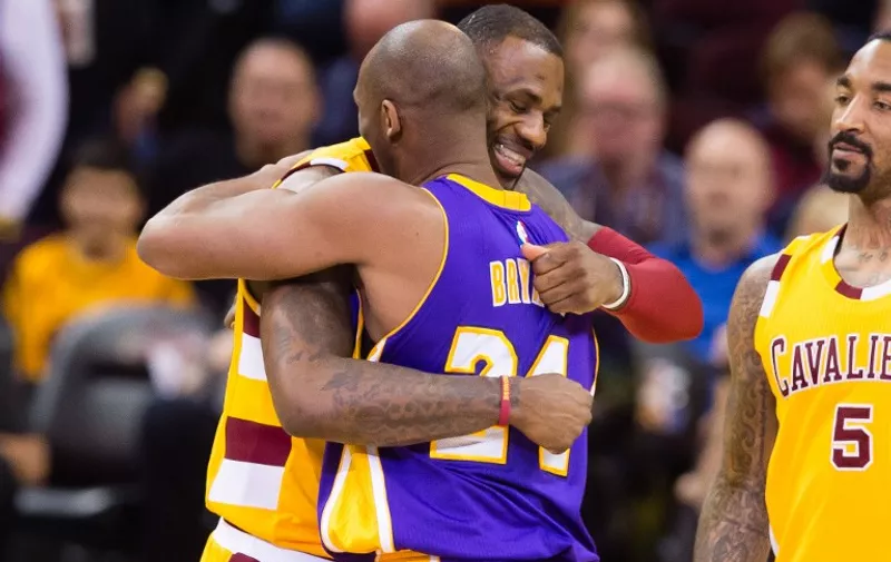 CLEVELAND, OH - FEBRUARY 10: LeBron James #23 of the Cleveland Cavaliers greets Kobe Bryant #24 of the Los Angeles Lakers during the first half at Quicken Loans Arena on February 10, 2016 in Cleveland, Ohio. NOTE TO USER: User expressly acknowledges and agrees that, by downloading and/or using this photograph, user is consenting to the terms and conditions of the Getty Images License Agreement. Mandatory copyright notice.   Jason Miller/Getty Images/AFP