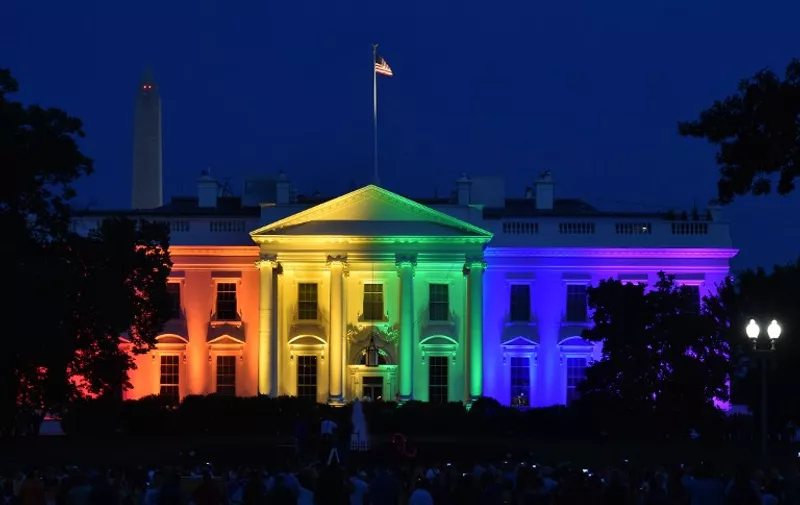 The White House is lightened in the rainbow colors in Washington on June 26. 2015. The US Supreme Court ruled Friday that gay marriage is a nationwide right, a landmark decision in one of the most keenly awaited announcements in decades and sparking scenes of jubilation. AFP PHOTO/MLADEN ANTONOV