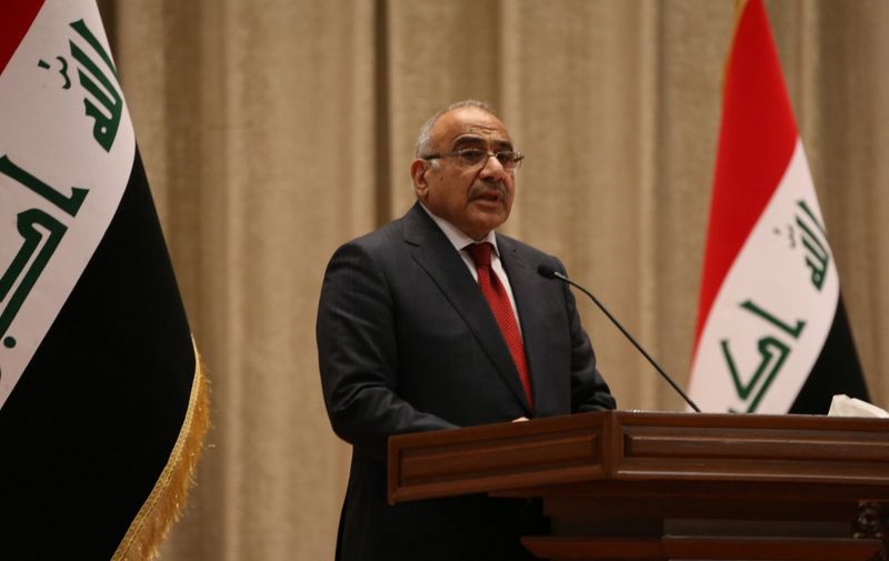 Adel Abdul Mahdi, the new prime minister, addresses the Iraqi parliament during the vote on the new government, October 24, 3018 in Baghdad. - The Iraqi parliament on Thursday approved 14 new cabinet ministers proposed by prime minister-designate Adel Abdel Mahdi, even as key portfolios such as defence and interior affairs remain unassigned, an official said. A total of 220 lawmakers out of 329 elected in May to a deeply divided parliamant, approved Mahdi's 14 picks, including for the ministries of foreign affairs, finances, and petroleum. (Photo by STR / AFP)
