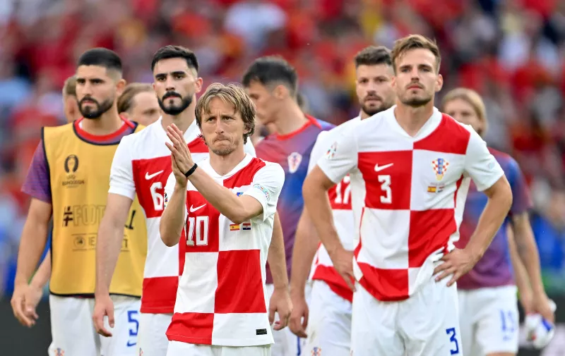 150624 KAI SCHWOERER Luka Modric of Croatia and his team mates react after the loss in the UEFA EURO, EM, Europameisterschaft,Fussball 2024 Group B match between Spain and Croatia at Olympiastadion on June 15, 2024 in Berlin, Germany. 150624-CPL-ESPvCRO-082