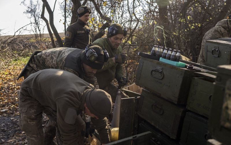 Ukrainian soldiers of an artillery unit prepare to fire towards Russian positions outside Bakhmut on November 8, 2022, amid the Russian invasion of Ukraine. (Photo by BULENT KILIC / AFP)