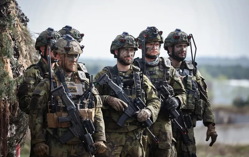 Soldiers of the Czech army are seen during the international military exercise Wettiner Schwert 2024 (Wettin Sword 2024) of Czech, Norwegian and German soldiers at the military training town Schnoeggersburg near Gardelegen, eastern Germany, on April 08, 2024. The NATO exercise Wettiner Schwert 2024 is part of the Quadriga 2024, which is the German contribution to the NATO Steadfast Defender major military exercises. (Photo by Ronny Hartmann / AFP)
