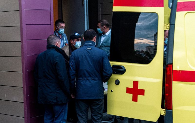 Medics load Alexei Navalny in an ambulance at Omsk Emergency Hospital No 1 where Navalny was admitted after he fell ill in what his spokeswoman said was a suspected poisoning in Omsk on August 22, 2020. - An ambulance took Russian opposition leader Alexei Navalny from the hospital where he was being treated in the city of Omsk to the airport for medical evacuation, his spokeswoman said. (Photo by Dimitar DILKOFF / AFP)