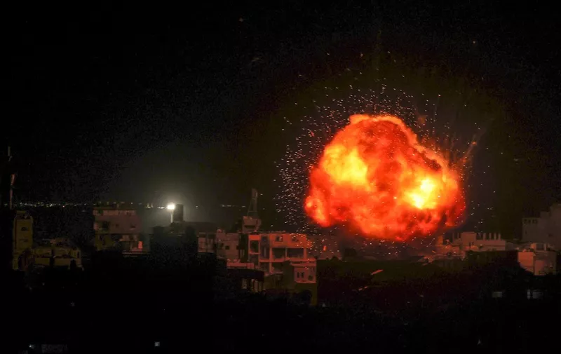 A fireball errupts during Isreali bombardment on Rafah, in the southern Gaza Strip, on March 26, 2024, amid ongoing battles between Israel and the Palestinian militant group Hamas. (Photo by Said KHATIB / AFP)
