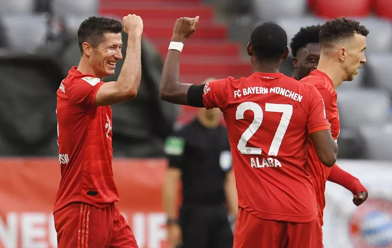 MUNICH, GERMANY - MAY 23: Robert Lewandowski of FC Bayern Muenchen celebrates with David Alaba after scoring his team's third goal during the Bundesliga match between FC Bayern Muenchen and Eintracht Frankfurt at Allianz Arena on May 23, 2020 in Munich, Germany. (Photo by Andreas Gebert/Pool via Getty Images)