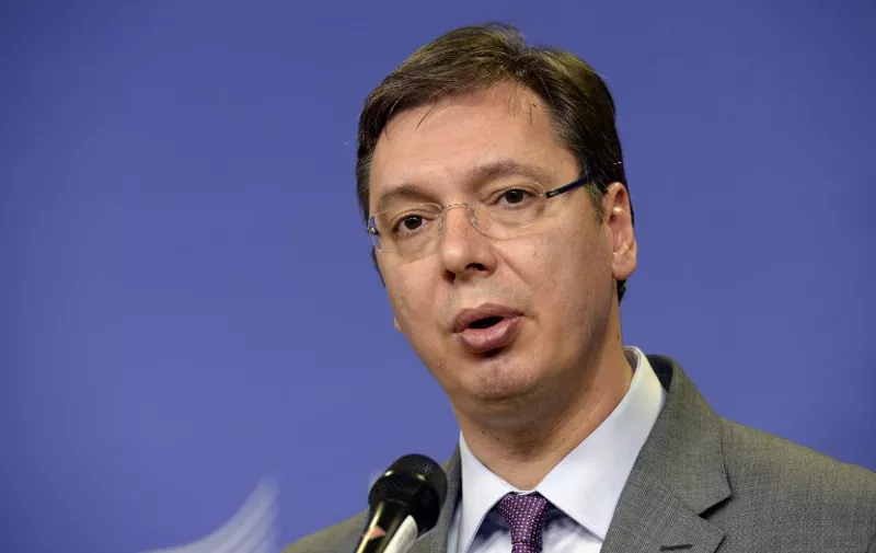 Serbian Prime Minister Aleksandar Vucic holds a press conference after an EU-Balkans mini summit at the EU headquarters in Brussels on October 25, 2015. European Union and Balkan leaders met to tackle the migrant crisis as Slovenia warned the bloc will "start falling apart" if it fails to take concrete action within weeks. AFP PHOTO / THIERRY CHARLIER